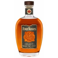 Dark amber bourbon in a crystal tumbler, glowing warm light